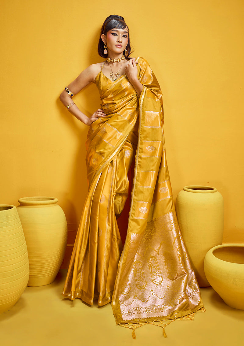 Mustard yellow satin silk saree with intricate golden zari border and handloom weaving