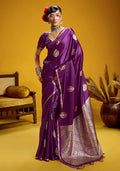 Deep purple satin silk handloom saree with elaborate zari woven details.