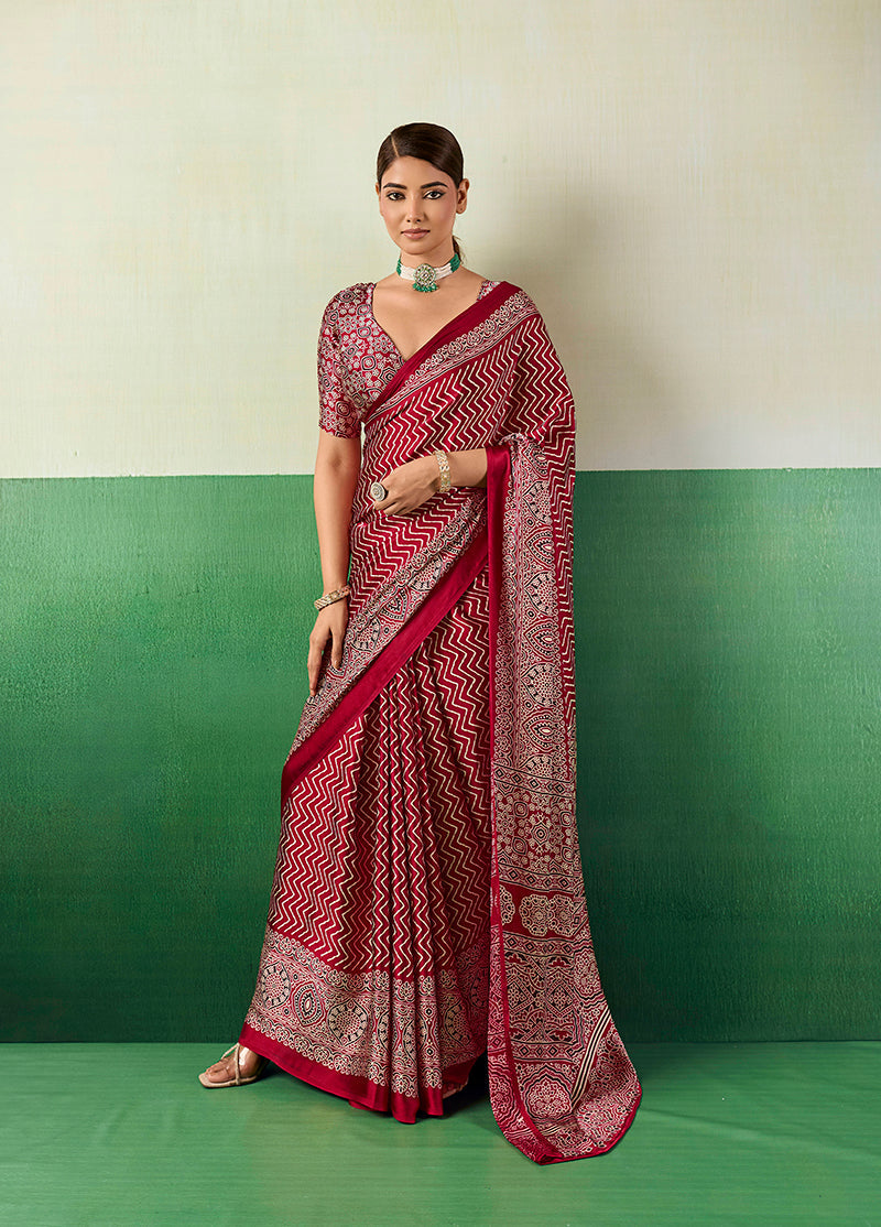 Maroon faux satin saree featuring traditional Ajrakh-inspired patterns and a smooth finish