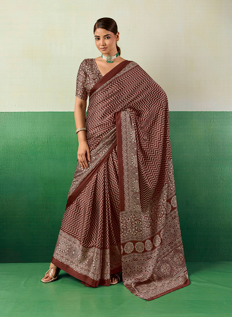 Monjolika Fashion brown faux satin saree with traditional Ajrakh-inspired prints
