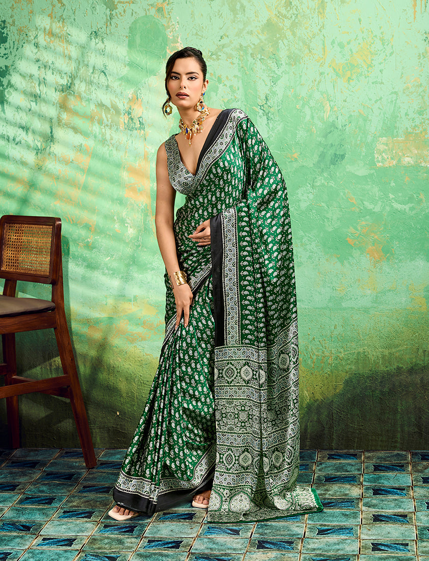 Green saree with traditional Ajrakh prints and a smooth faux satin finish.