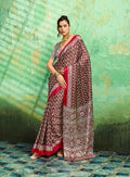 Brown faux satin saree featuring traditional Ajrakh prints and a lustrous finish