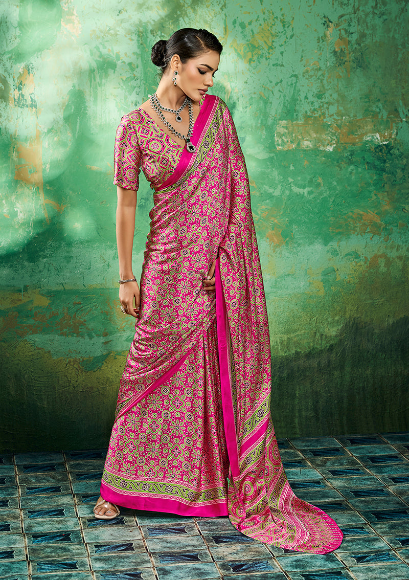 Vibrant hot pink modal faux satin saree adorned with artistic Ajrakh prints and borders
