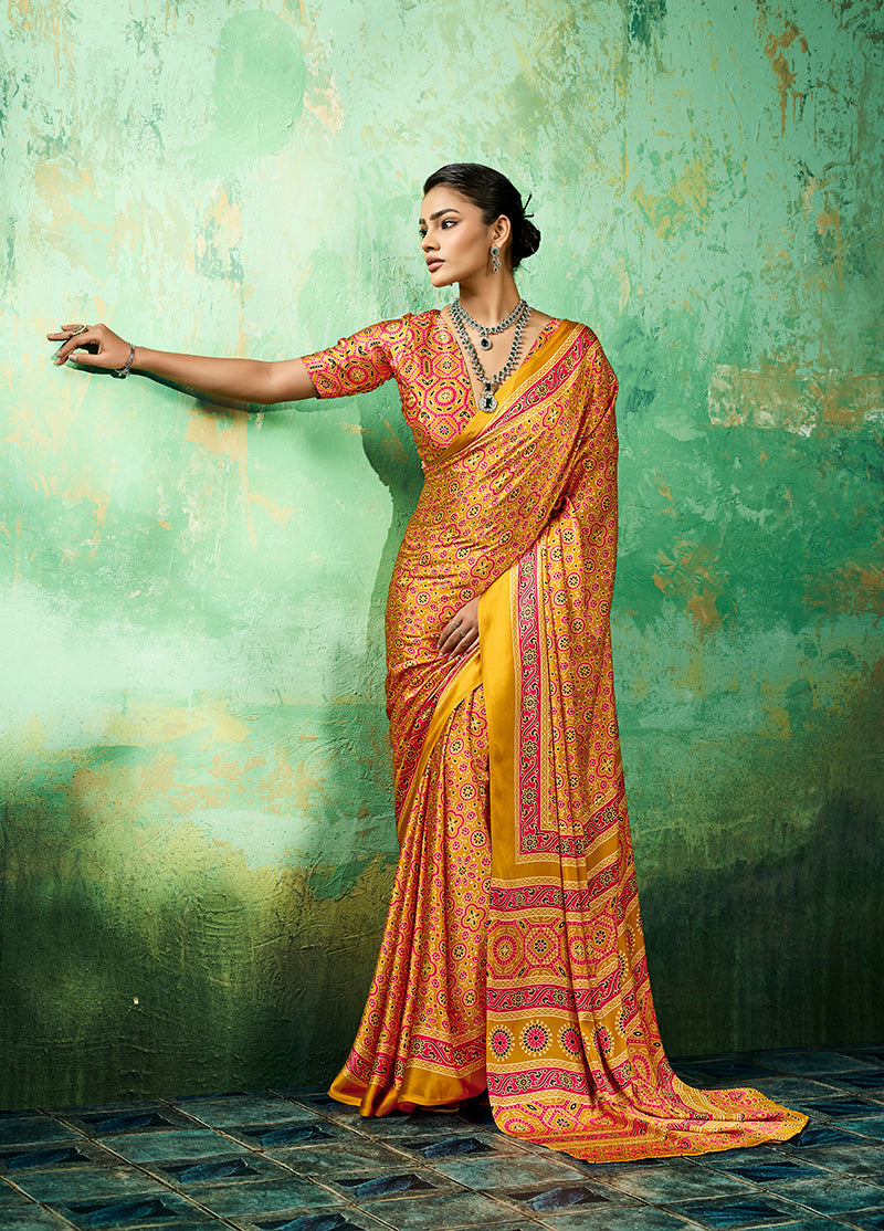 Monjolika Fashion Amber Faux Satin saree with traditional Ajrakh printed motifs and border.