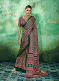 Green faux satin saree with traditional Ajrakh print and ethnic border