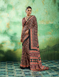 Monjolika Fashion black faux satin saree with traditional Ajrakh print and artistic borders