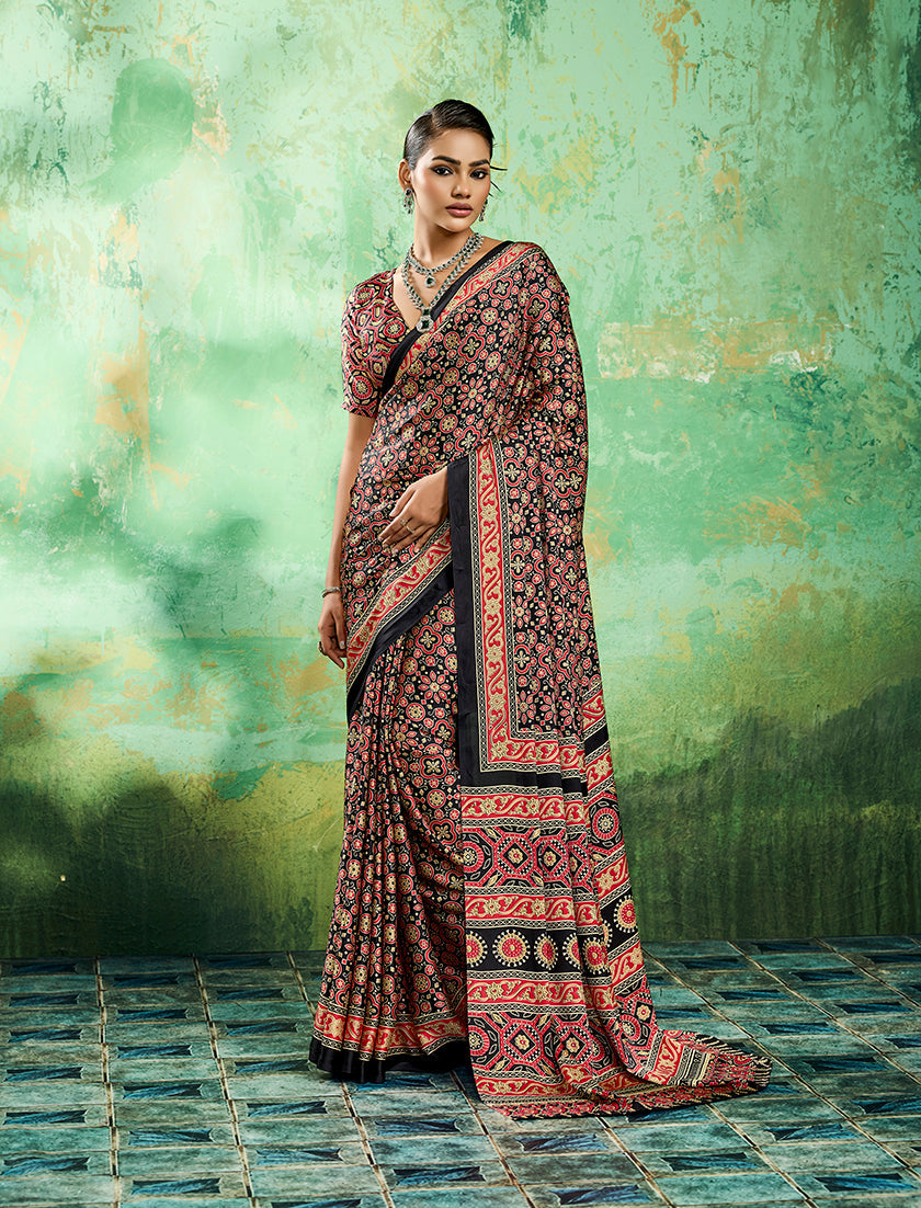 Monjolika Fashion black faux satin saree with traditional Ajrakh print and artistic borders