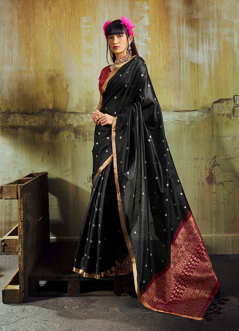 Black silk blend saree with intricate weaving and golden zari pallu