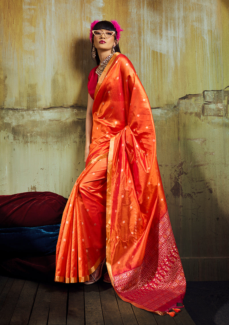 Elegant orange faux tussar silk saree with intricate zari woven pallu and golden border