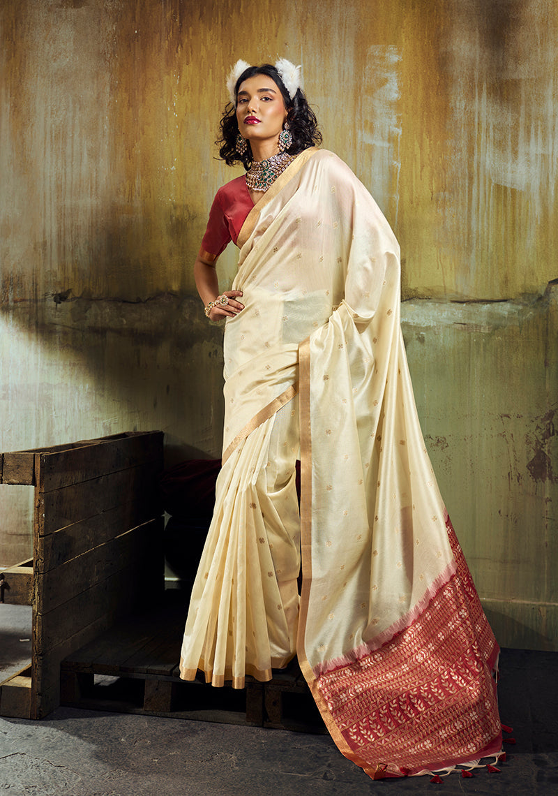 Classic cream faux tussar silk saree with ornate golden zari woven pallu