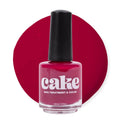 Bottle of CAKE Under the Affluence deep burgundy nail polish