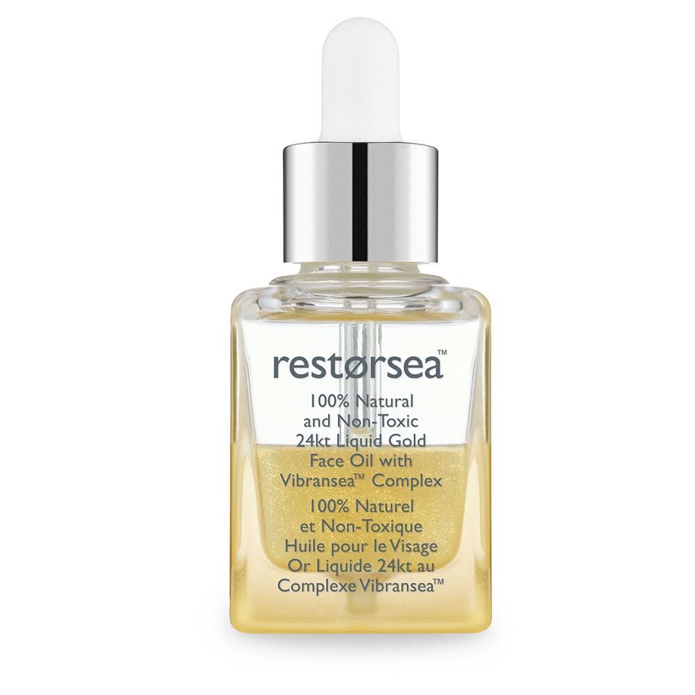 Bottle of Restorsea 24kt Liquid Gold Face Oil featuring a golden oil texture