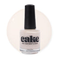 CAKE Nail Strengthening Polish in See You Latte, a warm creamy off-white shade in a 0.5 fl oz bottle.