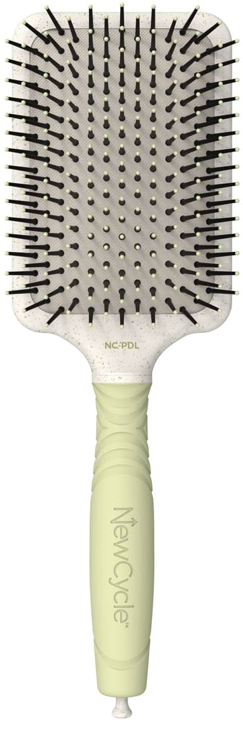 Large professional paddle hair brush with off-white cushion and black ionic bristles.