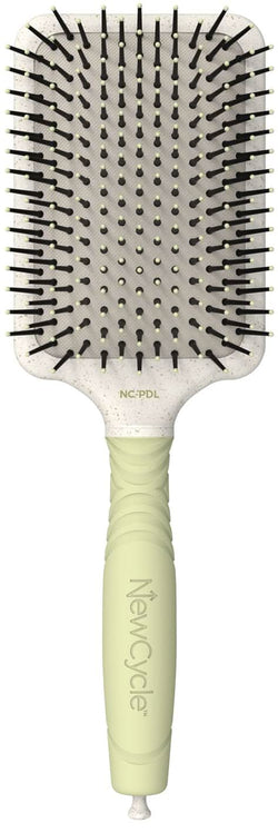 Large professional paddle hair brush with off-white cushion and black ionic bristles.