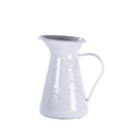 Grey Swirl 1 Quart Enamelware Pitcher with stainless steel rim on a dining table