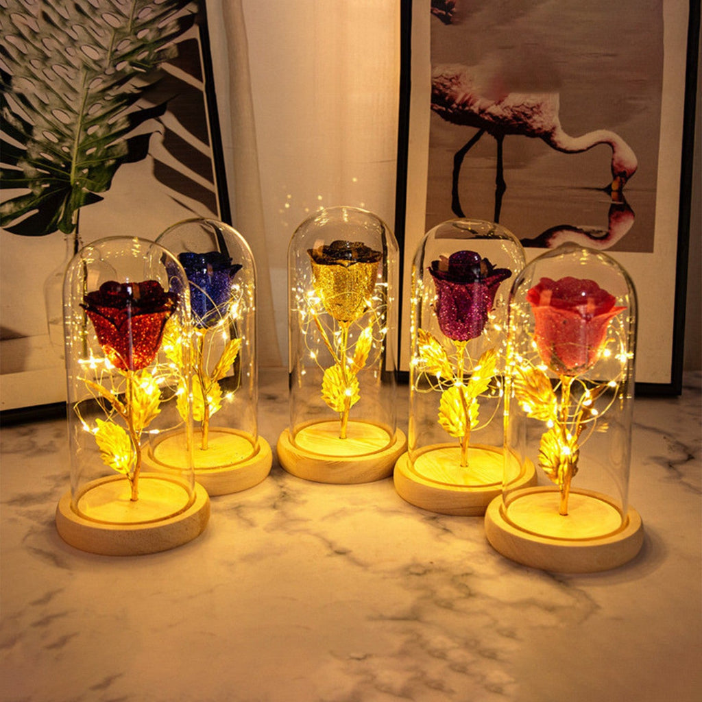 An eternal rose inside a glass dome with warm LED fairy lights, perfect for romantic gift giving.