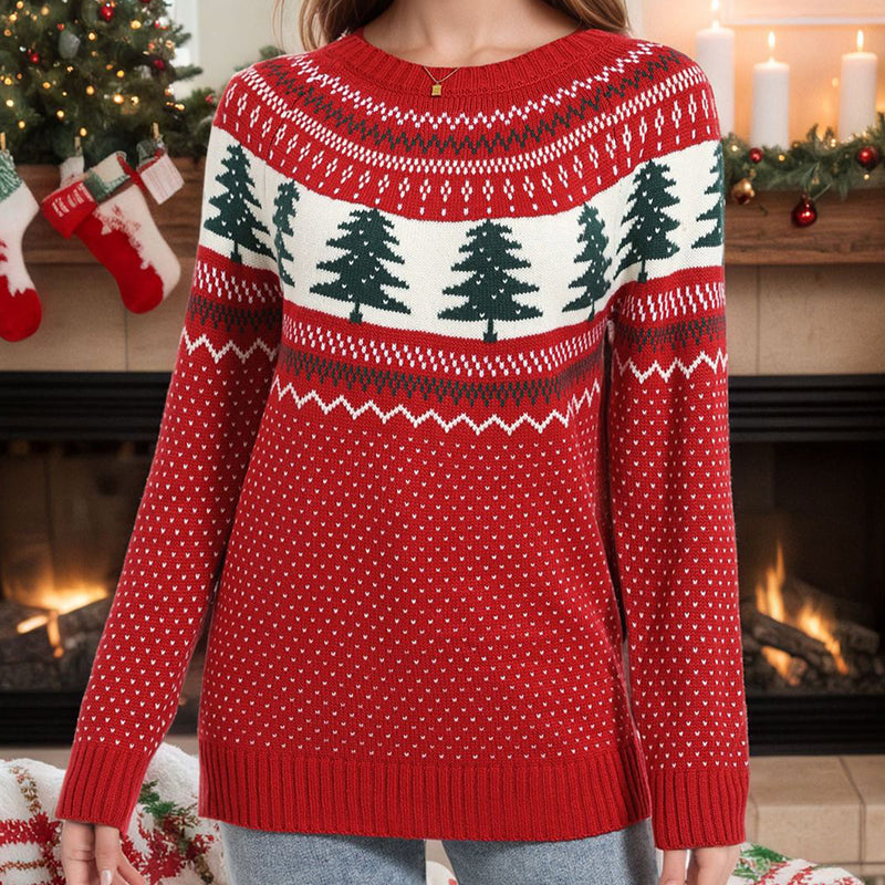 A woman wearing a red, green, and white festive pine pattern holiday sweater with a round neck.