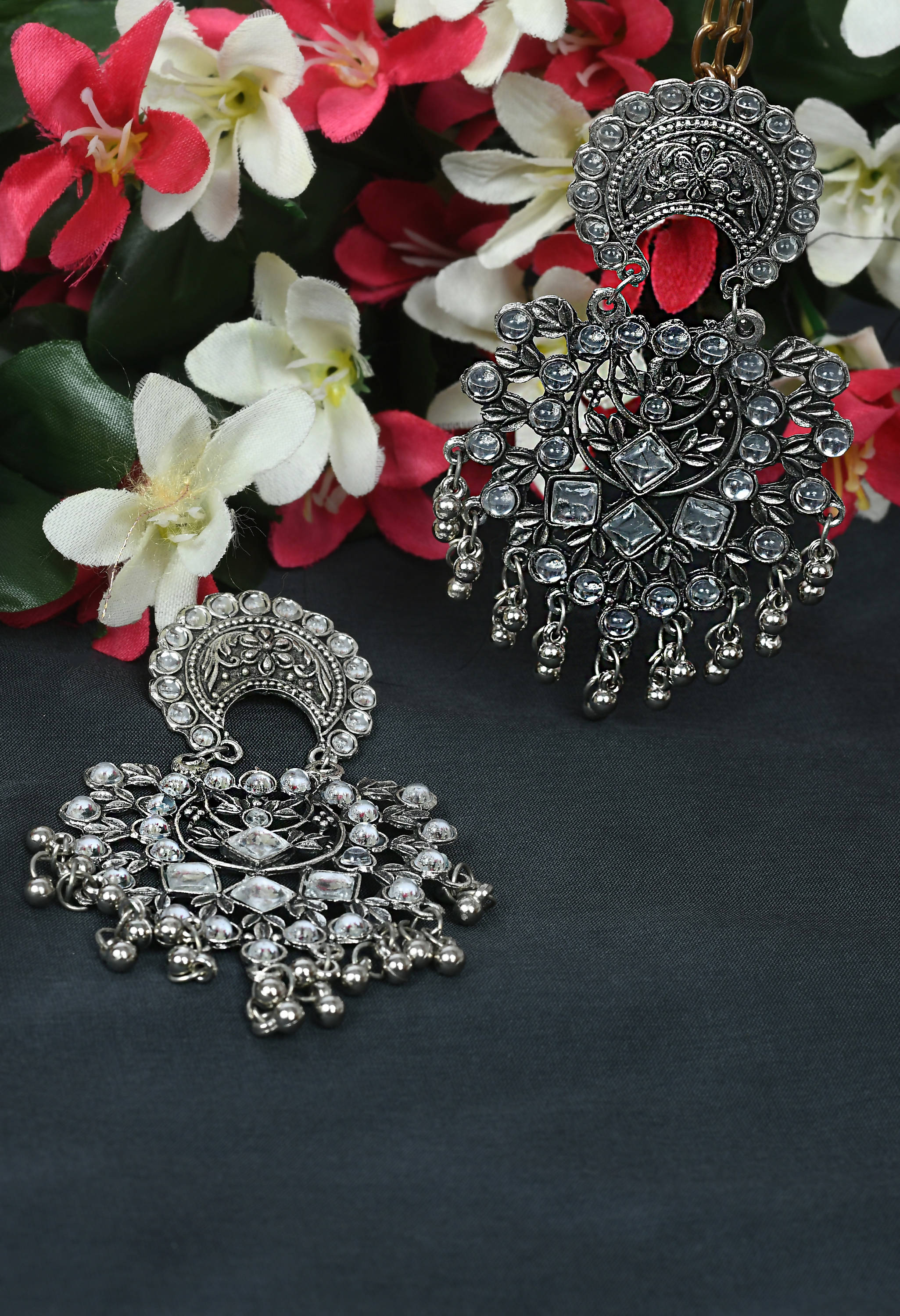 Elegant silver base earrings with intricate Kundan stone detailing