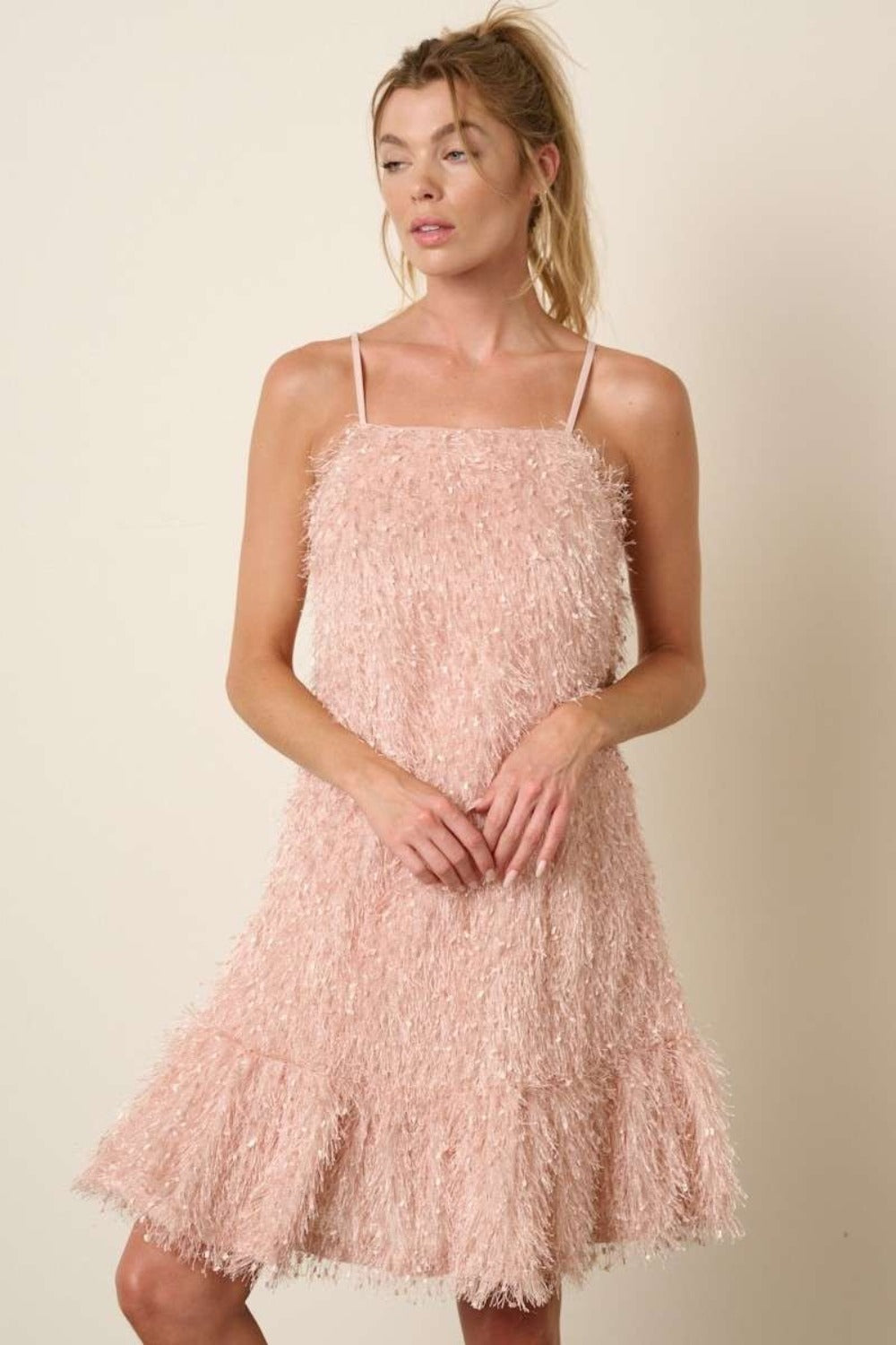 Blush pink mini cami dress with a decorative feather ruffle hemline