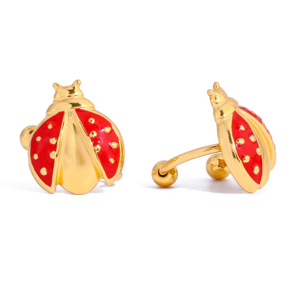 Gold ladybug ear cuff earring with a small pearl stud and red accents, made of waterproof stainless steel.