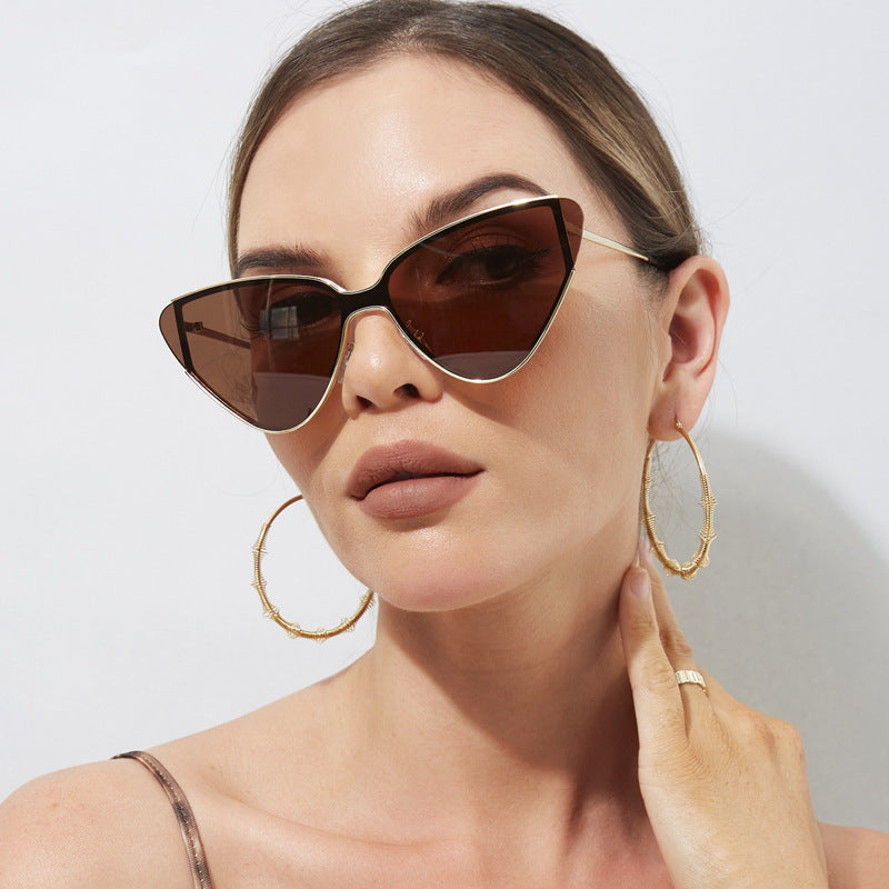 Vintage-style cat-eye sunglasses in classic black, brown, and gold