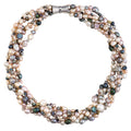 A multi-strand statement necklace made of mixed white, pink, and gray freshwater pearls with crystals and Tibetan accent beads, featuring a magnetic clasp.