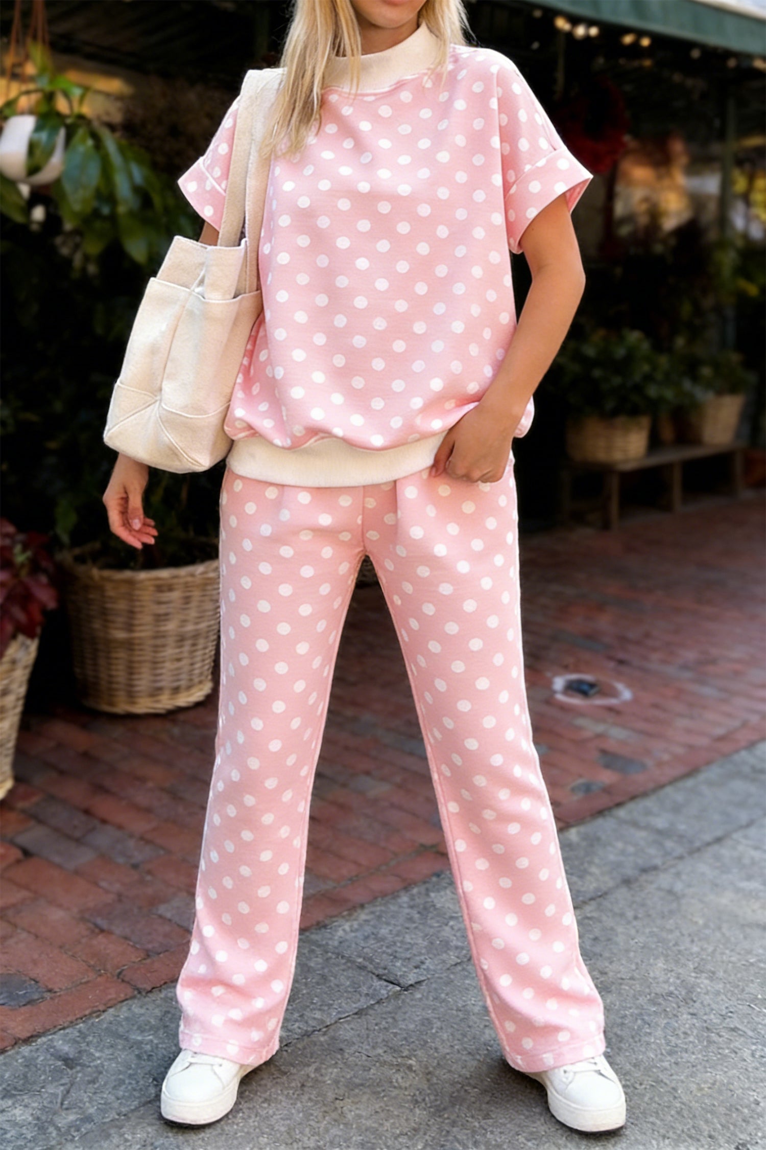 Pink polka dot print short sleeve mock neck top and matching shift pants set