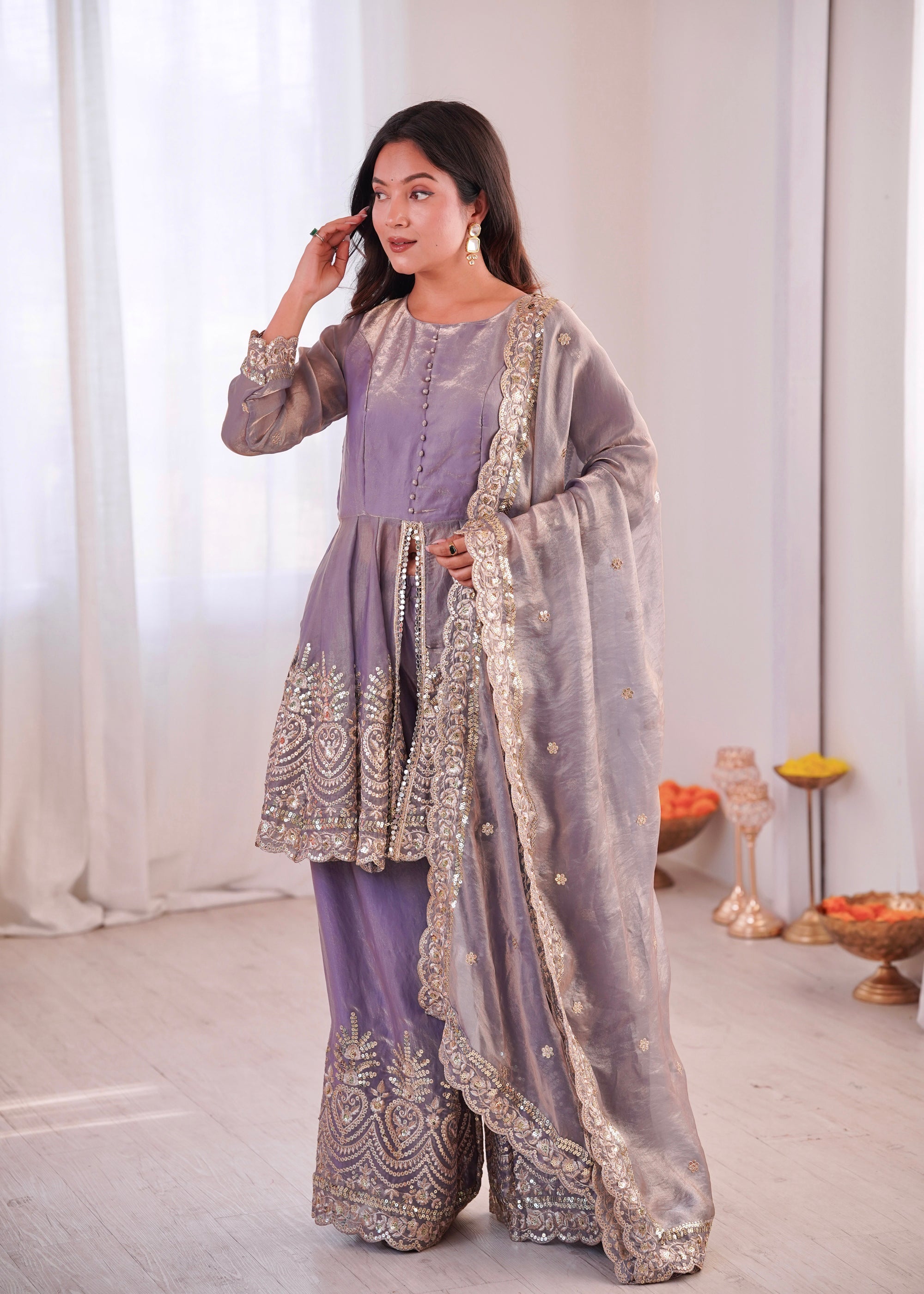 Lavender Fendy Satin Kurta and Palazzo set with intricate mirror and sequin embroidery.