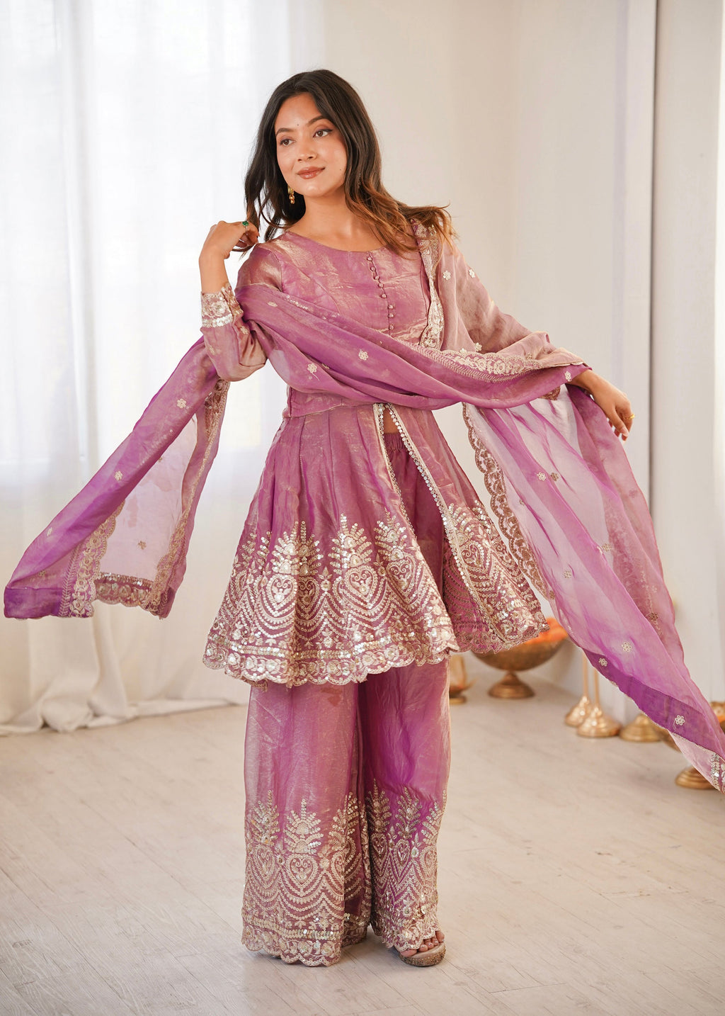 Front view of a pink Fendy satin kurta and palazzo set with embroidery, sequins, and real mirror work.