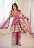 Front view of a pink Fendy satin kurta and palazzo set with embroidery, sequins, and real mirror work.