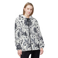 Woman wearing a monochromatic black and white floral print lightweight windbreaker jacket with a collar and zip-fly closure.