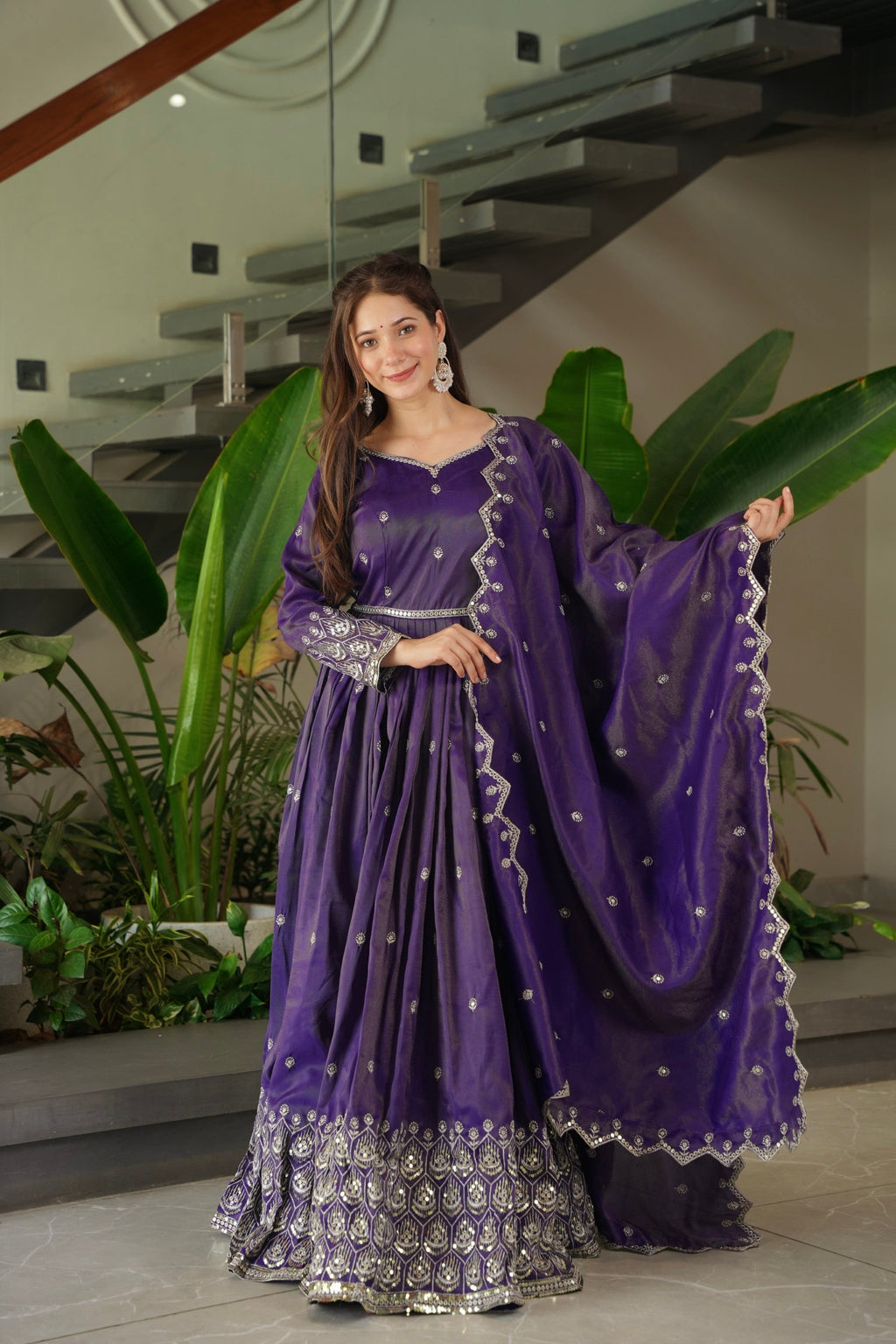 Front view of a purple shimmer silk Anarkali gown with sequin embroidery and matching dupatta