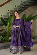 Front view of a purple shimmer silk Anarkali gown with sequin embroidery and matching dupatta