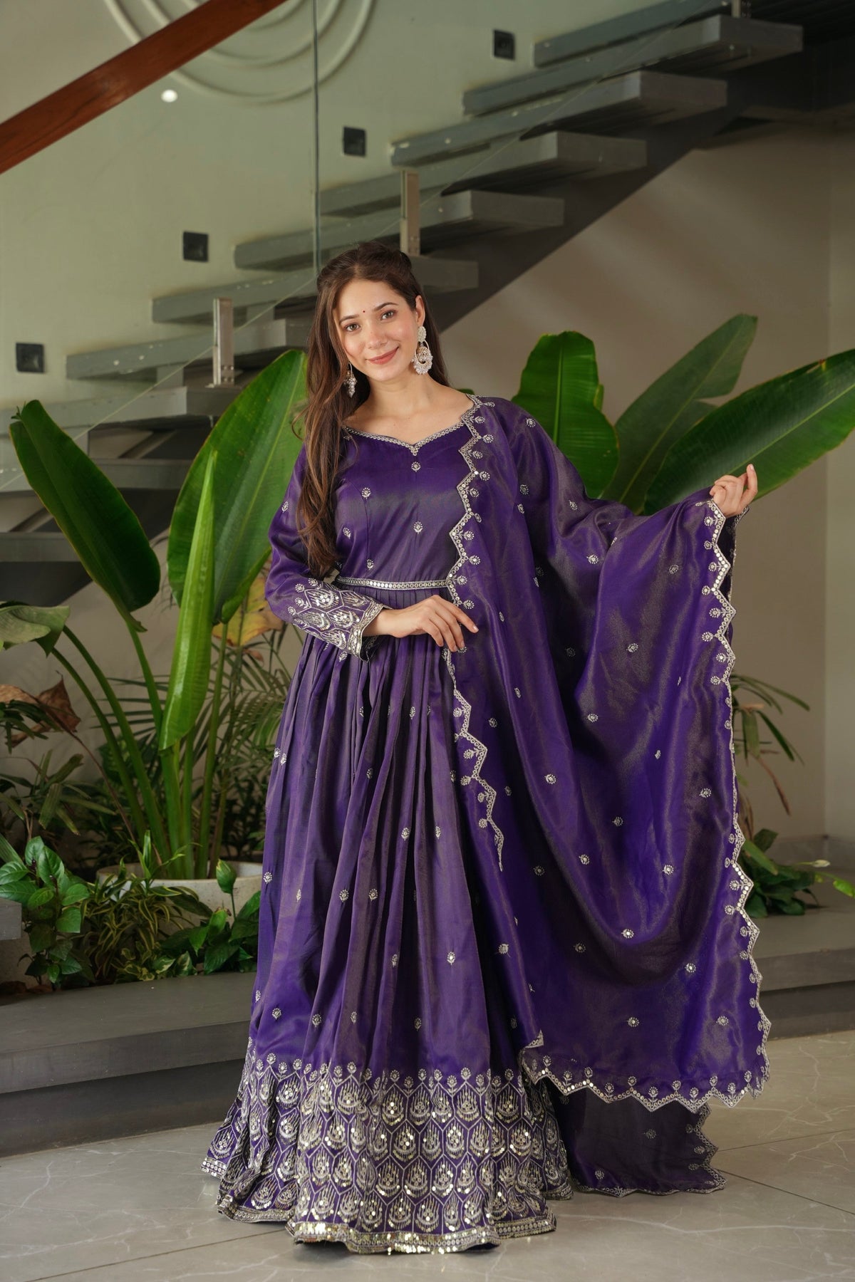 Front view of a purple shimmer silk Anarkali gown with sequin embroidery and matching dupatta