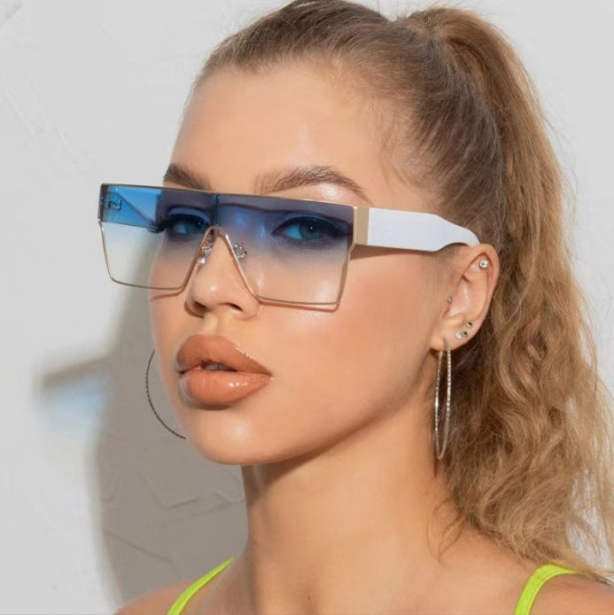 Oversized square metal frame sunglasses in a classic gold finish.