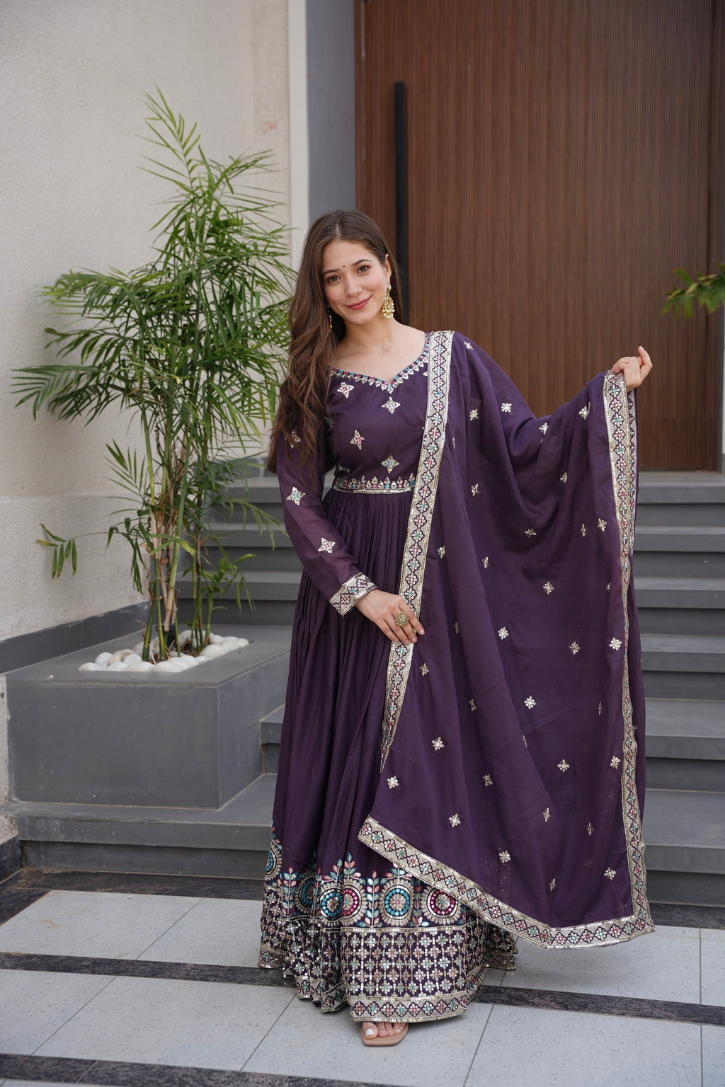 Wine diamond silk Anarkali gown with embroidery threads and sequins work, accompanied by a matching dupatta.