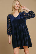Navy blue velvet mini dress with tiered skirt and dotted lace long sleeves