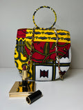 ZAI African print handbag with round handle and gold chain strap