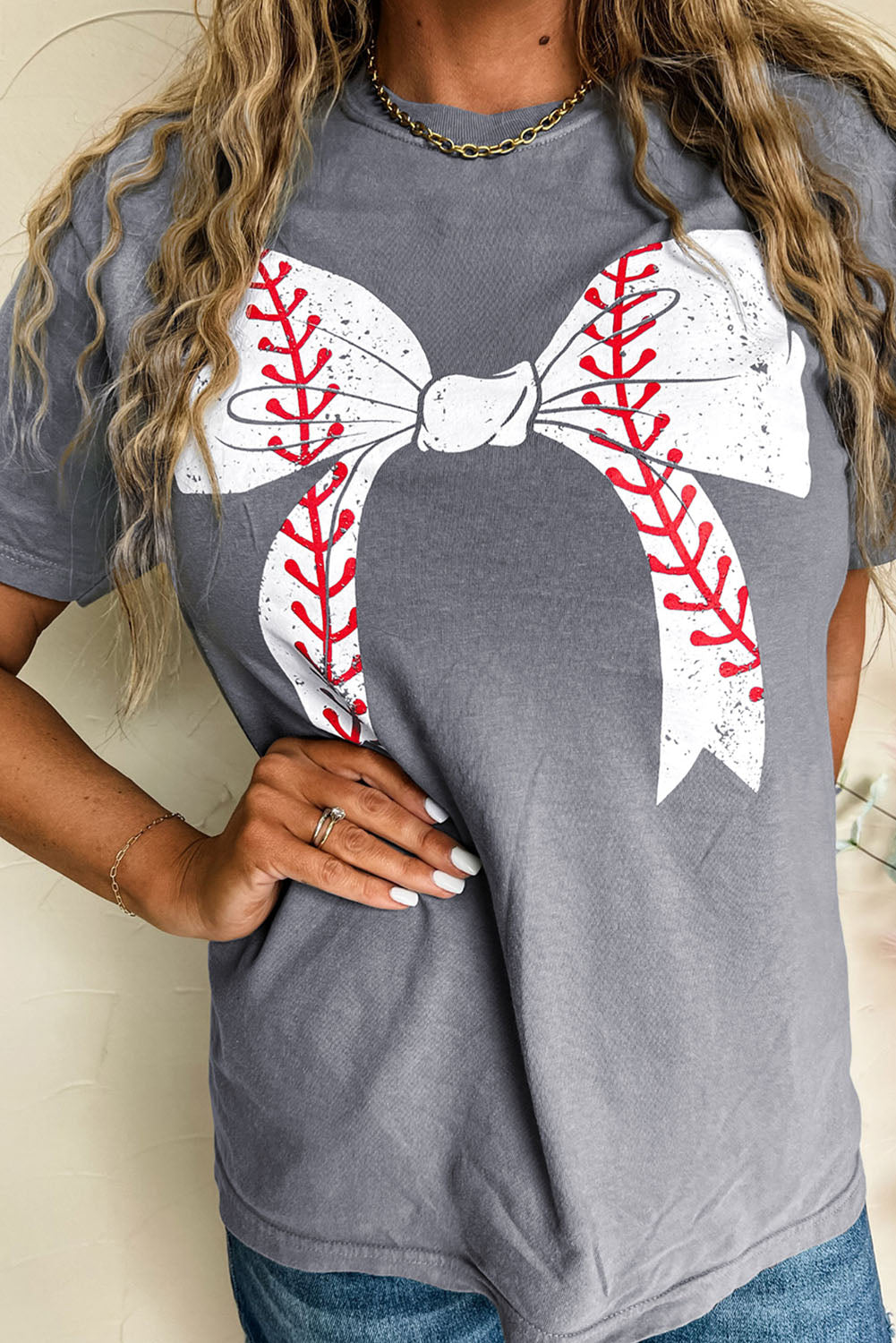 Gray short sleeve baseball graphic tee with bowknot detail and roll-up sleeves
