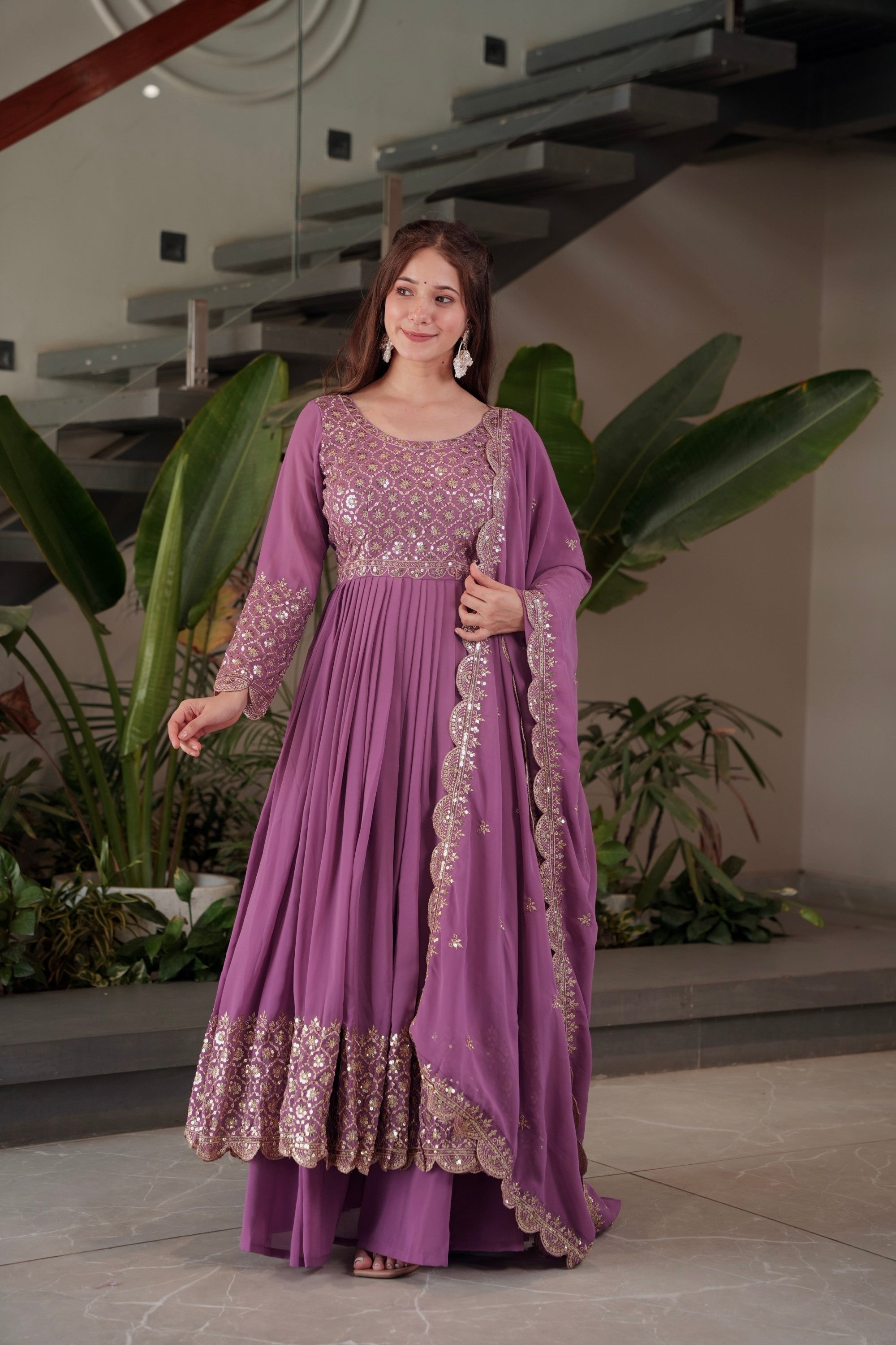 Lavender faux georgette Anarkali gown and sharara set with heavy embroidery and sequins work