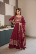 Maroon faux georgette Anarkali gown with heavy embroidery and sequins work, including sharara and dupatta.