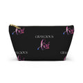Modern minimalist accessory pouch in black with pink and purple gradient typography and zip closure