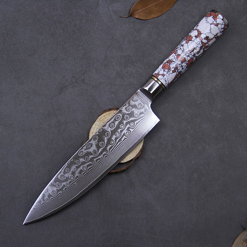 8-inch Damascus steel chef knife with a vibrant turquoise handle on a wooden kitchen surface