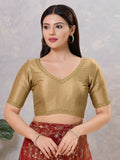 Radiant gold silk stitched blouse with V-neckline for formal ethnic wear.