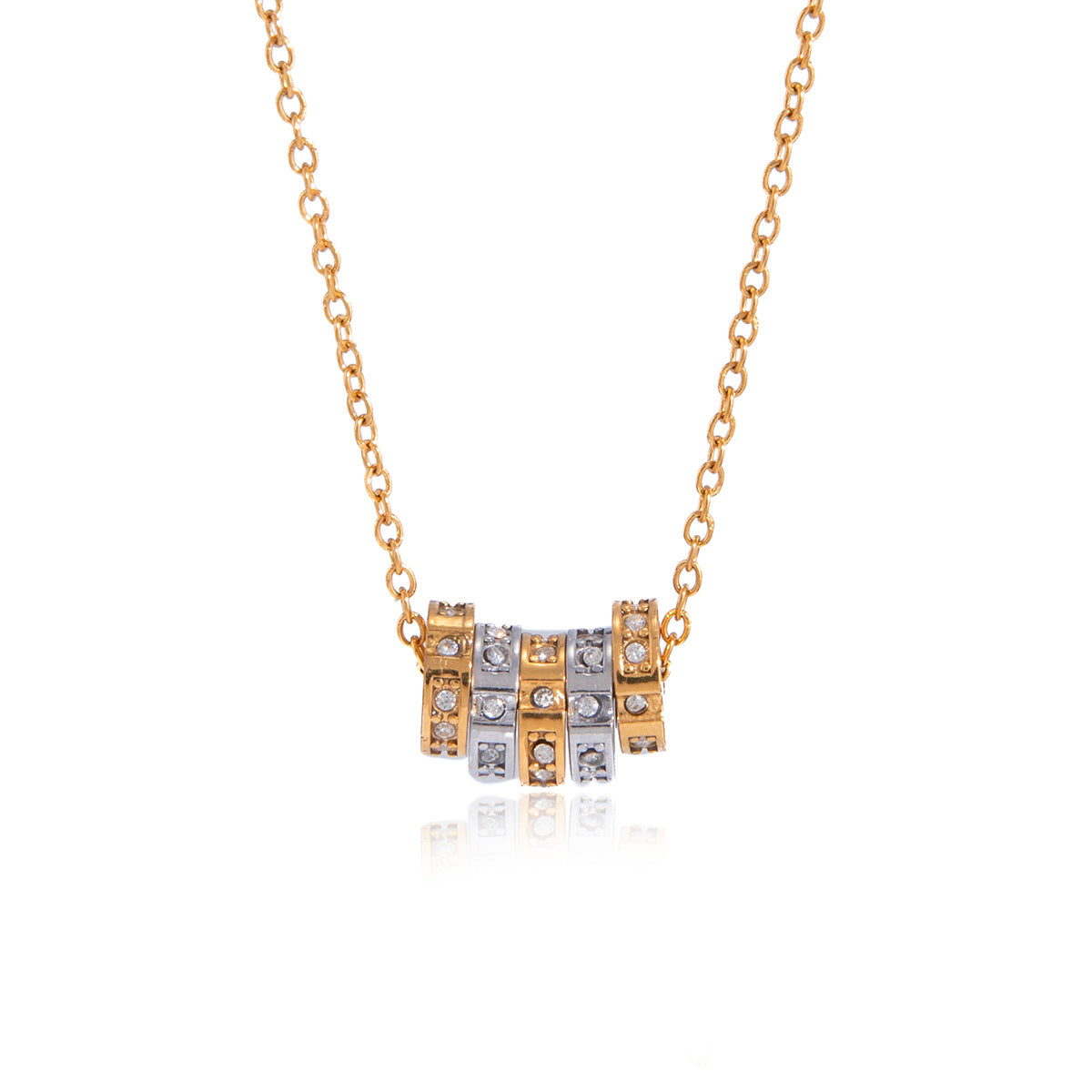 Minimalist stainless steel spinner pendant necklace featuring zircon accents in gold and silver finish.