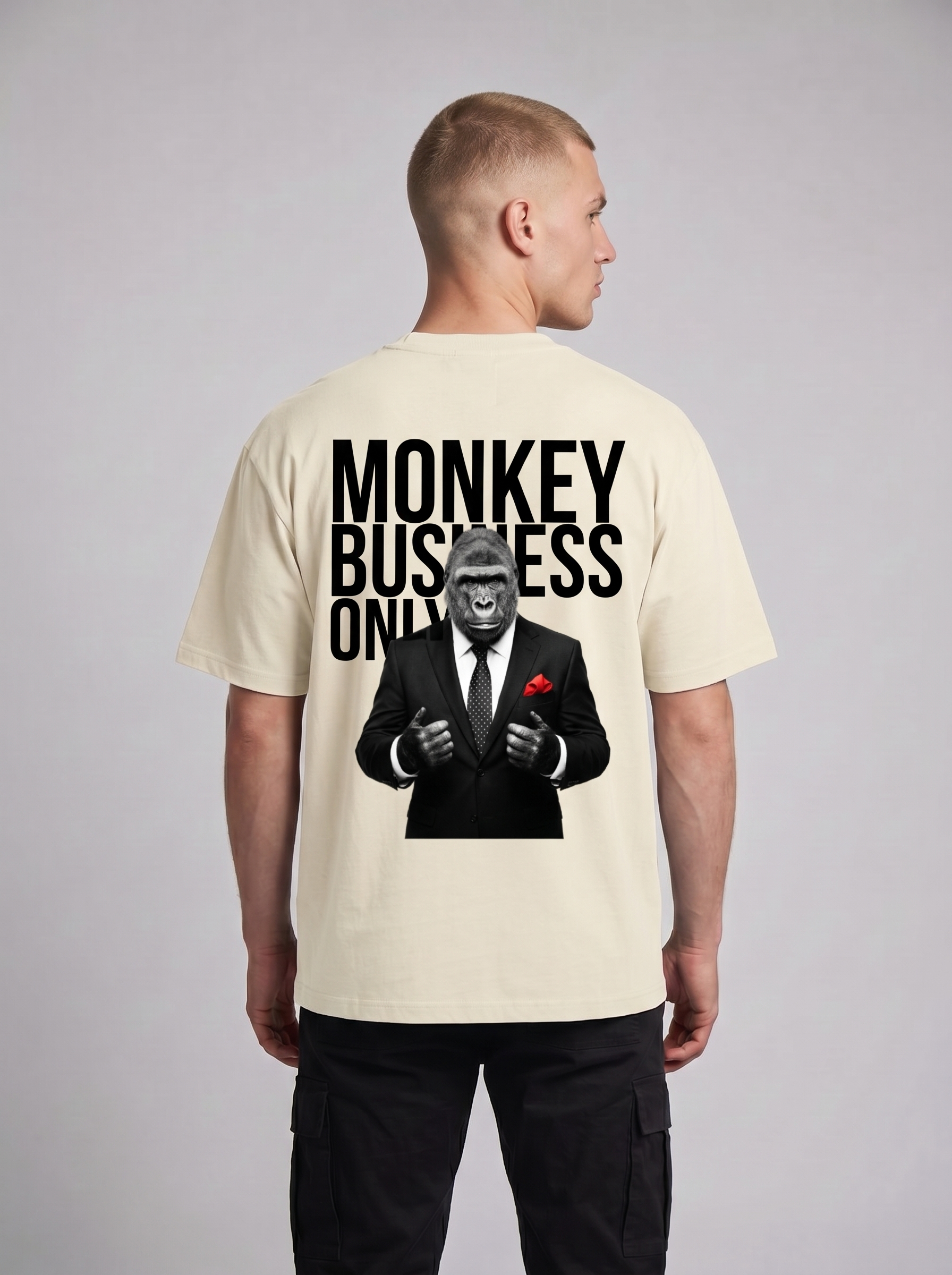 Oversized beige, black, white, and red graphic tee featuring a sharp-dressed gorilla design.