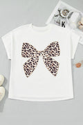 A white short-sleeved t-shirt with a large leopard print bow embroidery patch on the front, displayed flat on a neutral background.