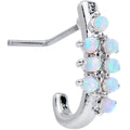 Close up of a 20G L-shaped nose ring with white synthetic opal stones and a faux hoop design on a white background