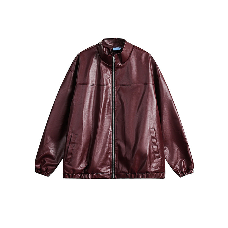 Front view of a women's burgundy faux leather zip-up bomber jacket with paneled design and stand-up collar.